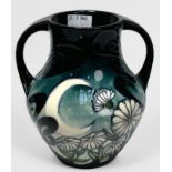 A Moorcroft pottery vase in the Winters Moon pattern by Vicky Lovatt, of bulbous two handled form,