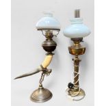 A Victorian brass oil lamp with brass Corinthian column base and resevoir, glass chimney and