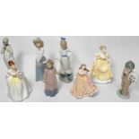 A collection of assorted ceramic figures including a Royal Doulton ‘Flower of Love HN2460’, Coalport