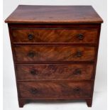 A 19th century oak chest of small proportions and three drawers with original handles and