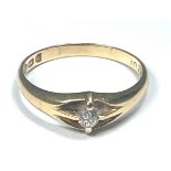 An 18ct yellow gold gents dress ring, set with a Victorian cut diamond to the centre, estimated