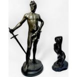 After Anton Nelson (1880 - 1910) A patinated spelter sculpture of a Grecian male holding a sword,