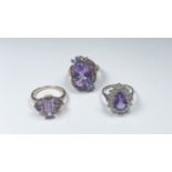 Three 9ct yellow gold ladies various design dress rings, all set with amethyst gemstones, total