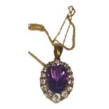 A 9ct yellow gold pendant and chain, the pendant set with a large oval shaped amethyst to the