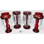 Two pairs of glass lustres with clear glass drops, ruby flashed glass, crimped rim to globular form,