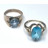 Two 9ct gold dress rings, both set with blue faceted stones, total weight 7.4 grams.