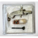 An Austrian miniature pinfire pistol, with breech-loading barrel and grip engraved with a rabbit and