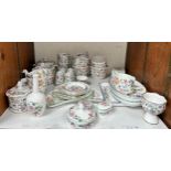 A collection of assorted Minton Haddon Hall and Haddon Hall Blue tea wares, including teapots, cups,