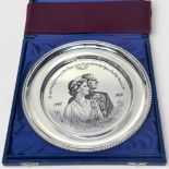 A silver plate by John Pinches, commemorating the Silver Wedding Anniversary of Her Majesty Queen