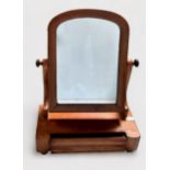 A 19th century walnut toilet mirror, with platform base and pulvinated drawer, together with an oval