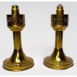 A pair of Mason 'Constant Flame' brass telescopic candle lamps, with pierced sconces and weighted