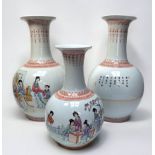 A garniture of three Chinese porcelain 'poem' vases, of globular form with tall necks and flared
