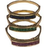 Three 14ct gold dress rings, one channel set with rubies, one with emeralds, and one with sapphires,