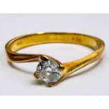 An 18ct yellow gold solitaire diamond ring, the round brilliant cut diamond weighs an estimated 0.