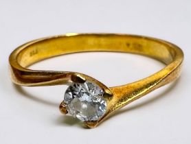 An 18ct yellow gold solitaire diamond ring, the round brilliant cut diamond weighs an estimated 0.