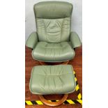 A matched pair of green leather swivel and reclining armchairs, each with footstools