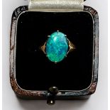 A 9ct gold ring, centrally claw set with an oval opal, gross weight approximately 1.8g