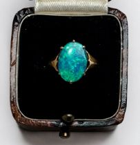 A 9ct gold ring, centrally claw set with an oval opal, gross weight approximately 1.8g