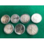 Seven 1oz. fine silver USA dollars for 2002, 3, 4, 5, 9, 13 and 2015, and an American Eagle and