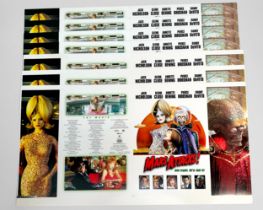 A quantity of professionally printed and uncut promotional material for various films, predominantly