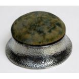 A circular silver Arts & Crafts trinket/ring box by George Nathan and Ridley Hayes, with planished