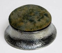 A circular silver Arts & Crafts trinket/ring box by George Nathan and Ridley Hayes, with planished