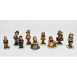Nine assorted Goebel figures including School Boy, School Girl, Autumn Harvest, Street Singer and