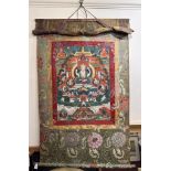 A 19th Century Tibetan Thangka, (hanging prayer flag scroll) painted with central figure of Buddha