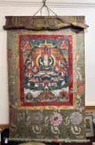 A 19th Century Tibetan Thangka, (hanging prayer flag scroll) painted with central figure of Buddha