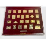 The Empire Collection of twenty-five silver gilt stamps, by Hallmark Replicas Limited, in fitted