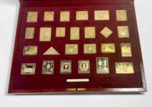 The Empire Collection of twenty-five silver gilt stamps, by Hallmark Replicas Limited, in fitted