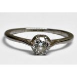 A platinum solitaire diamond ring, claw set with a round brilliant cut diamond, estimated diamond