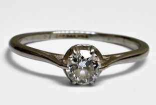 A platinum solitaire diamond ring, claw set with a round brilliant cut diamond, estimated diamond