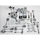 A small collection of assorted silver including a pair of tongs modelled as a wishbone and a pair of