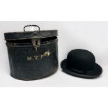 A Henry Heath bowler hat in tin box, together with three ladies 1950s hats on cylindrical vinyl