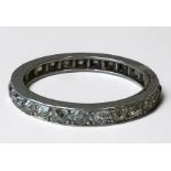 A platinum eternity ring wet with 25 old cut diamonds, estimated total diamond weight 1.25cts, gross