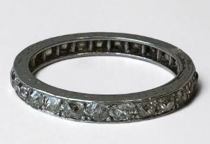 A platinum eternity ring wet with 25 old cut diamonds, estimated total diamond weight 1.25cts, gross