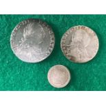 Three silver coins. Two George III coins with some toning and discoloration but generally nice