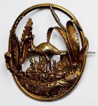 A yellow metal, tests as 14ct gold oval brooch, pierced and worked with an Emu amidst foliage,
