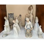 Eleven assorted blue and white Spanish ceramic figures of children, women and birds, including