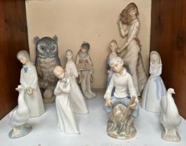 Eleven assorted blue and white Spanish ceramic figures of children, women and birds, including