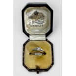 An 18ct gold and platinum solitaire diamond ring, total diamond weight approximately 0.22cts,