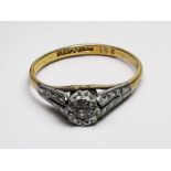 WITHDRAWN: An 18ct yellow gold and platinum ring, illusion set with a small diamond to the centre,