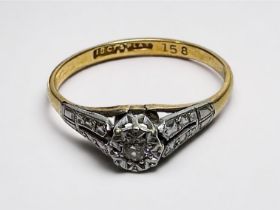 WITHDRAWN: An 18ct yellow gold and platinum ring, illusion set with a small diamond to the centre,