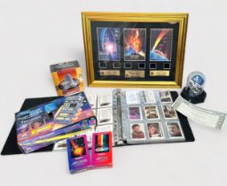 A collection of assorted Star Trek figures, collector cards, replicas, telephone cards, etc., to