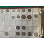 An album containing a collection of approximately 95 coins, including an 1844 half-farthing, 1913