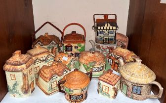 Thirty-three various Cottageware ceramic teapots, jugs, butter dish and biscuit barrels, comprising,