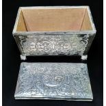 An Edwardian Silver casket of rectangular form, with loose cover and cedar lining, with all-over