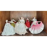 A collection of ten porcelain figurines of ladies comprising Royal Doulton, Coalport and Royal