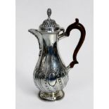 A Victorian silver coffee pot by George Fox, of baluster form with reeded and floral decoration to